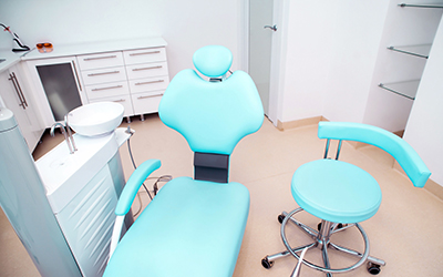 Dental clinic interior with chair and tools