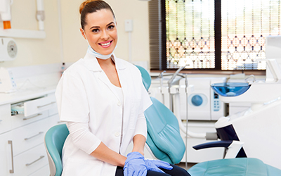 A dental assistant smiling